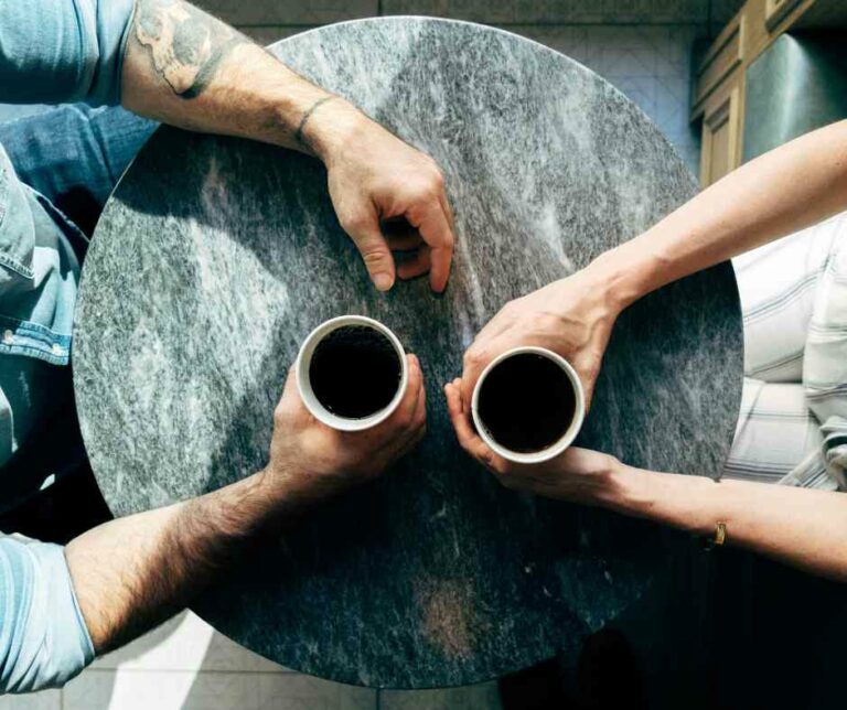 couple sharing coffee understanding betrayal trauma